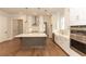 Well-lit kitchen features an island, stainless steel appliances, and white cabinets at 2381 Siskin Square Rd, Duluth, GA 30096