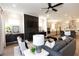 Open living space with modern fireplace, tv, and kitchen with large island at 2381 Siskin Square Rd, Duluth, GA 30096