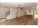 Open-concept living room flowing to the kitchen and featuring beautiful hardwood floors at 2381 Siskin Square Rd, Duluth, GA 30096