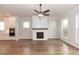 Open living space featuring hardwood floors, fireplace, and modern kitchen at 2381 Siskin Square Rd, Duluth, GA 30096