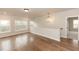 Upstairs loft with natural light, hardwood floors, and modern lighting at 2381 Siskin Square Rd, Duluth, GA 30096