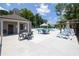 Community pool with tables, lounge chairs, and a nearby recreation building at 2381 Siskin Square Rd, Duluth, GA 30096