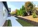 Landscaped backyard featuring a concrete patio and carefully placed mulch beds with mature trees at 2710 Sandy Irwin Sw Ct, Marietta, GA 30064