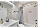 Clean bathroom with white vanity, modern fixture, shower/tub combo, and white subway tile at 2710 Sandy Irwin Sw Ct, Marietta, GA 30064