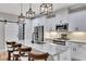 Stylish kitchen with white cabinets, granite counters, a barn door, and stainless steel appliances at 2710 Sandy Irwin Sw Ct, Marietta, GA 30064