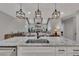 Modern kitchen with granite countertops, stainless steel appliances, and an open view to the living room at 2710 Sandy Irwin Sw Ct, Marietta, GA 30064