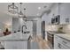 Gourmet kitchen featuring stainless steel appliances, white cabinets, and a center island at 2710 Sandy Irwin Sw Ct, Marietta, GA 30064