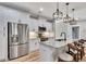 Bright, modern kitchen with stainless steel appliances, white cabinetry, and granite countertops at 2710 Sandy Irwin Sw Ct, Marietta, GA 30064