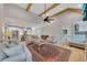 Open-concept living room with wood floors, fireplace, and seamless access to kitchen with modern appliances at 2710 Sandy Irwin Sw Ct, Marietta, GA 30064