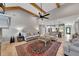 Open-concept living room and kitchen with wood floors and abundant natural light creates an inviting atmosphere at 2710 Sandy Irwin Sw Ct, Marietta, GA 30064