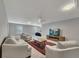 Well-lit living room featuring neutral colors, ceiling fan, comfortable seating, and a media center at 2710 Sandy Irwin Sw Ct, Marietta, GA 30064