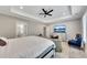Large main bedroom featuring a tray ceiling, a TV, and an ensuite bathroom at 2710 Sandy Irwin Sw Ct, Marietta, GA 30064