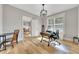 Bright office with hardwood floors, a desk, a large window with shutters, and neutral paint at 2710 Sandy Irwin Sw Ct, Marietta, GA 30064