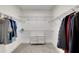 Walk-in closet with shelving and clothing racks for optimal organization, and a small cabinet at 2710 Sandy Irwin Sw Ct, Marietta, GA 30064