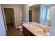Bathroom featuring a double sink vanity, a large mirror and a door to a separate shower and toilet at 3104 Leyland Ct, Decatur, GA 30034