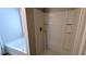 A bright white bathroom showcasing a large tub, a separate shower, and built-in shelving at 3104 Leyland Ct, Decatur, GA 30034