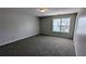 Bedroom features neutral paint, carpet, and one window with blind at 3104 Leyland Ct, Decatur, GA 30034
