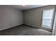 Bedroom showcases neutral paint, carpet, and one window with blind at 3104 Leyland Ct, Decatur, GA 30034
