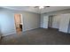 Bedroom featuring neutral paint, carpet, and access to ensuite bathroom and closet space at 3104 Leyland Ct, Decatur, GA 30034