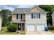 Charming two-story home with a two-car garage and well-manicured lawn, creating a welcoming curb appeal at 3104 Leyland Ct, Decatur, GA 30034
