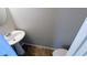 Practical half-bath with a pedestal sink and toilet, providing convenience for guests at 3104 Leyland Ct, Decatur, GA 30034