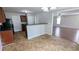 Efficient kitchen with a breakfast bar, seamlessly connecting to the adjacent living spaces for easy entertaining at 3104 Leyland Ct, Decatur, GA 30034