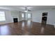 Open-concept living room with hardwood floors and a fireplace, seamlessly connecting to other living spaces at 3104 Leyland Ct, Decatur, GA 30034
