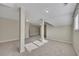 Finished basement featuring carpet flooring and support columns, perfect for entertaining at 313 Red Fox Dr, Canton, GA 30114