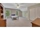 Bedroom with ceiling fan, large windows with views, and carpet at 313 Red Fox Dr, Canton, GA 30114
