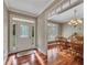Elegant entryway with hardwood floors, decorative glass door, and adjacent dining room at 313 Red Fox Dr, Canton, GA 30114