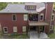 Back exterior view of the home featuring a deck, patio, and well-maintained landscaping at 313 Red Fox Dr, Canton, GA 30114
