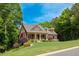 Charming two-story home featuring a landscaped yard and a welcoming front porch at 313 Red Fox Dr, Canton, GA 30114