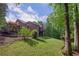 Beautiful two-story house featuring a large green lawn and back deck at 313 Red Fox Dr, Canton, GA 30114
