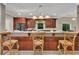 Modern kitchen with stainless steel appliances, granite countertops, and breakfast bar seating at 313 Red Fox Dr, Canton, GA 30114