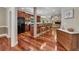 Open-concept kitchen with granite counters, dark wood cabinetry, and adjacent living space at 313 Red Fox Dr, Canton, GA 30114