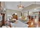 Open concept living room featuring a fireplace, hardwood floors, and an open view to the kitchen at 313 Red Fox Dr, Canton, GA 30114