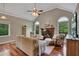 Spacious living room with vaulted ceilings, a fireplace, and abundant natural light at 313 Red Fox Dr, Canton, GA 30114