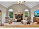 Cozy living room with a fireplace, vaulted ceilings, and neutral décor at 313 Red Fox Dr, Canton, GA 30114