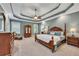 Main bedroom boasts a tray ceiling, neutral colors, and wood furniture at 313 Red Fox Dr, Canton, GA 30114