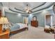 Main bedroom with hardwood furniture, a trey ceiling, and an outside deck view at 313 Red Fox Dr, Canton, GA 30114