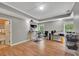 Spacious office with hardwood floors, two windows, and a door leading to a bathroom at 313 Red Fox Dr, Canton, GA 30114