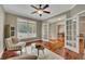 Bright home office featuring hardwood floors, ample natural light, and French door entry at 313 Red Fox Dr, Canton, GA 30114