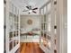 Inviting home office with French doors, hardwood floors, and cozy seating area at 313 Red Fox Dr, Canton, GA 30114