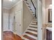 Lovely staircase with stained wood steps and white risers, leading to the upper level at 313 Red Fox Dr, Canton, GA 30114