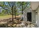 The home features a private patio area with room for seating, backing onto a grassy common area at 3149 Kingswood Gln, Decatur, GA 30034