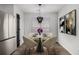 Cozy dining area with modern chandelier, seating for four, and natural light at 3149 Kingswood Gln, Decatur, GA 30034