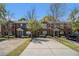 Attractive brick townhome featuring neat landscaping, individual driveways, and dark shutters at 3149 Kingswood Gln, Decatur, GA 30034