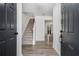 Inviting foyer featuring hardwood floors, staircase, and neutral wall paint throughout at 3149 Kingswood Gln, Decatur, GA 30034