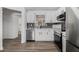 Updated kitchen featuring stainless steel appliances, sleek backsplash, and white cabinetry at 3149 Kingswood Gln, Decatur, GA 30034