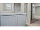 Bathroom featuring a modern vanity with a white countertop and a large mirror at 3573 Stonebranch Ln, Loganville, GA 30052